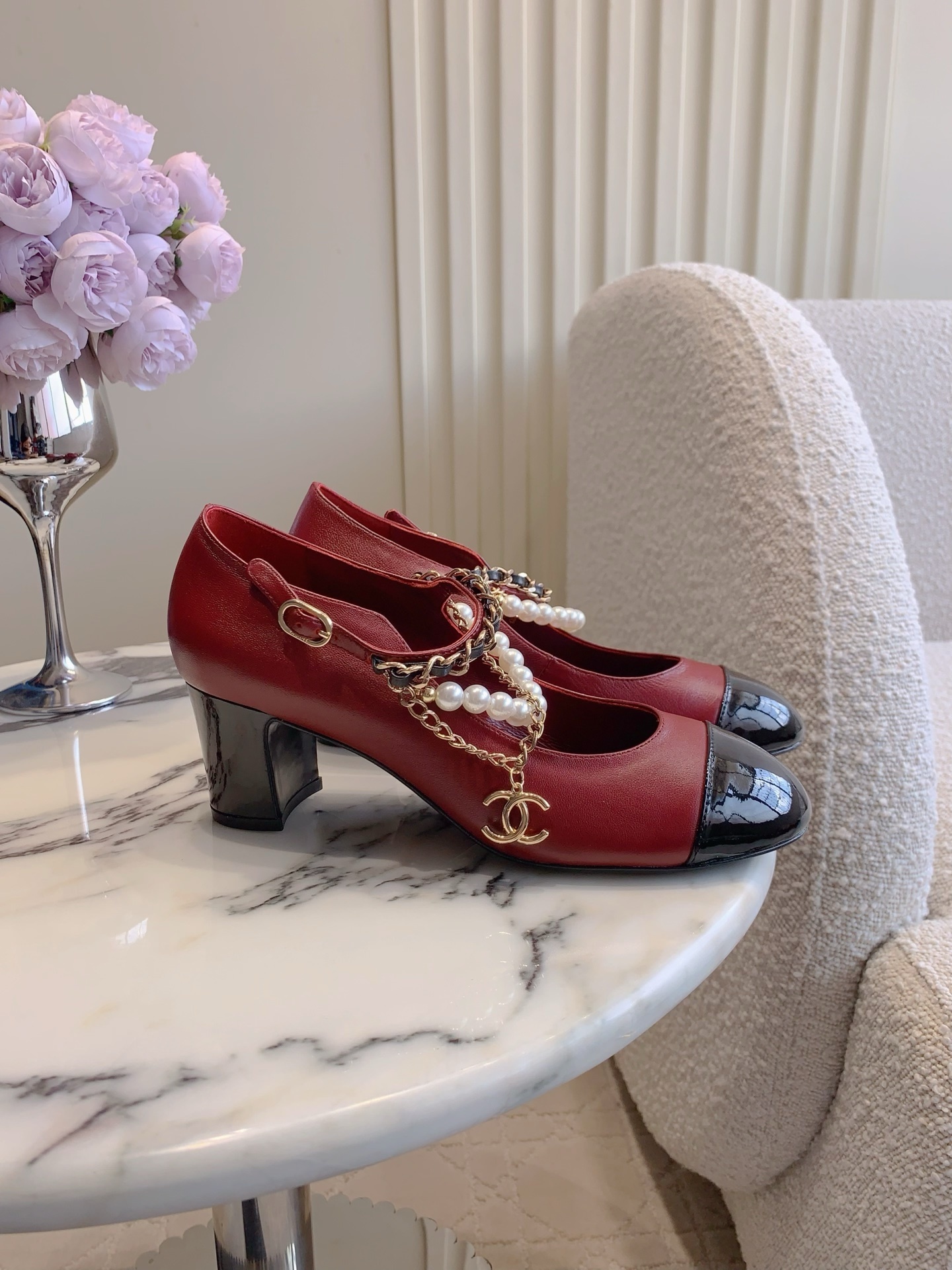 Chanel Red Leather Pumps with Black Cap Toe and Pearl Chain