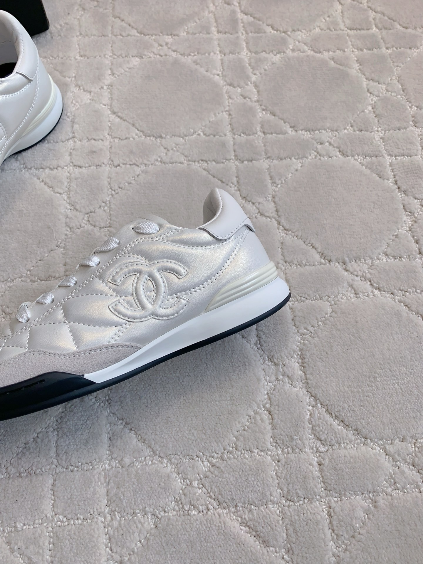 Chanel White Quilted Leather Sneakers - Luxury Designer Footwear