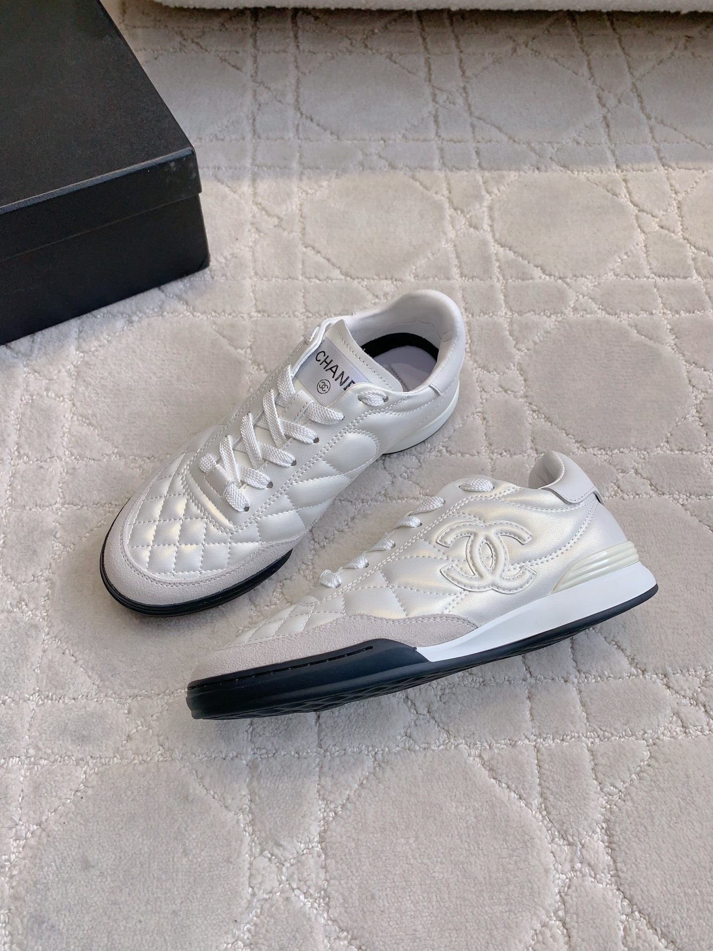 Chanel White Quilted Leather Sneakers - Luxury Designer Footwear