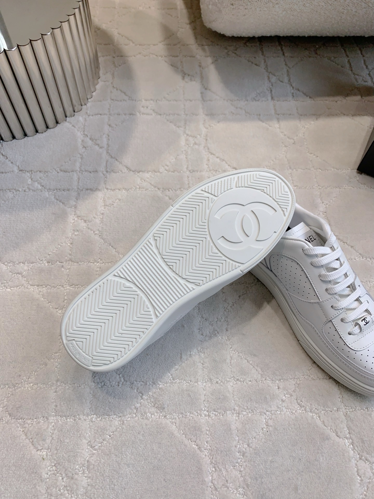 Pair of premium white Chanel calfskin leather sneakers with CC logo and perforated detailing. - Hình 9