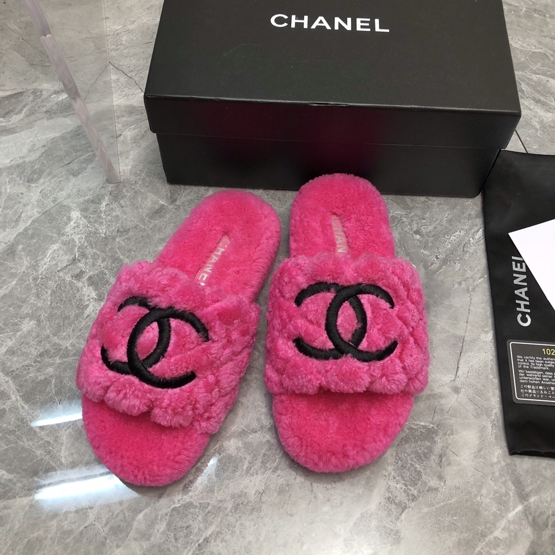A pair of bright pink fluffy Chanel slippers with a black CC logo, shown with original black box and authenticity card. - Hình 9