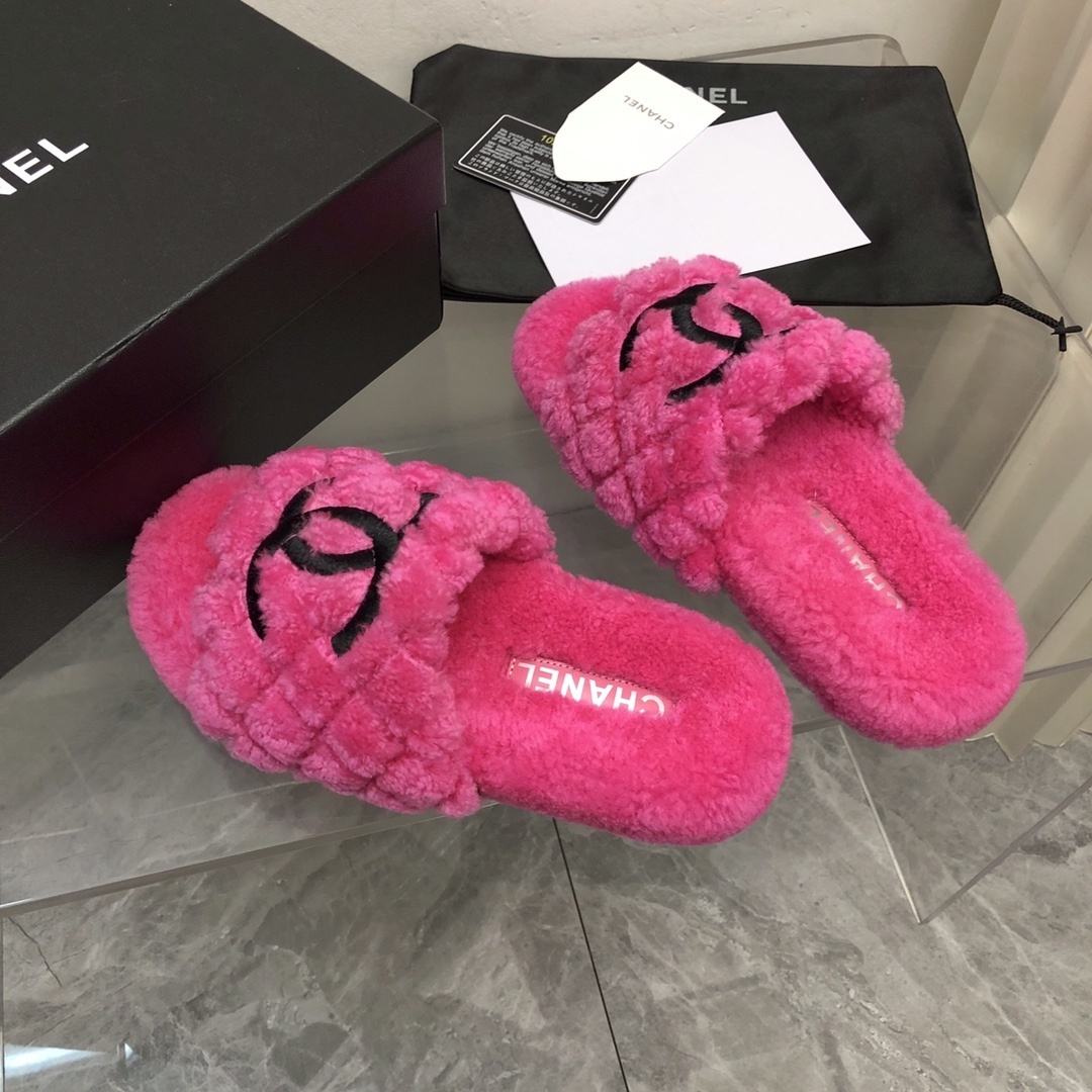 A pair of bright pink fluffy Chanel slippers with a black CC logo, shown with original black box and authenticity card. - Hình 8