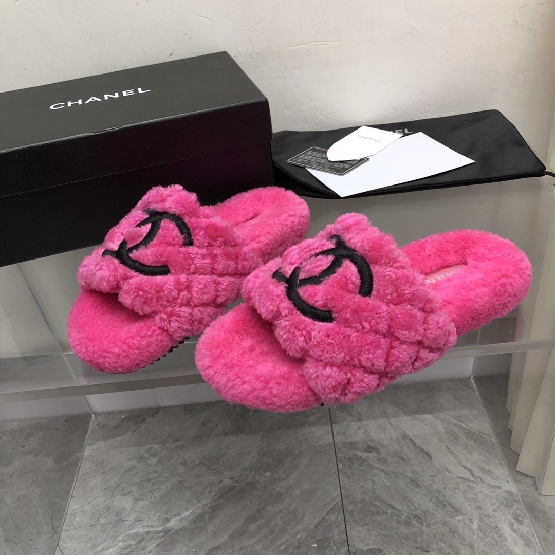 A pair of bright pink fluffy Chanel slippers with a black CC logo, shown with original black box and authenticity card. - Hình 7