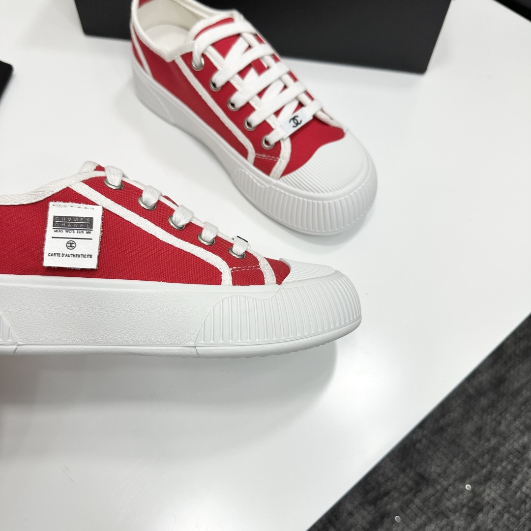 Pair of red canvas low-top sneakers with thick white platform soles and white laces - Hình 9