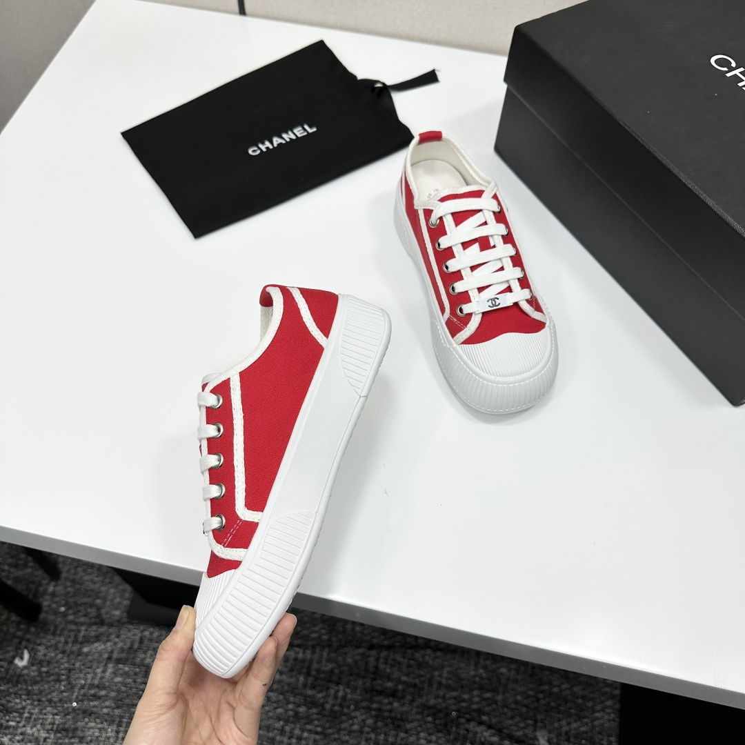 Pair of red canvas low-top sneakers with thick white platform soles and white laces - Hình 8