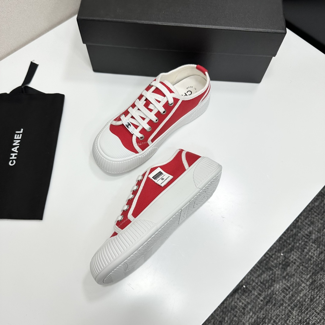 Pair of red canvas low-top sneakers with thick white platform soles and white laces - Hình 6
