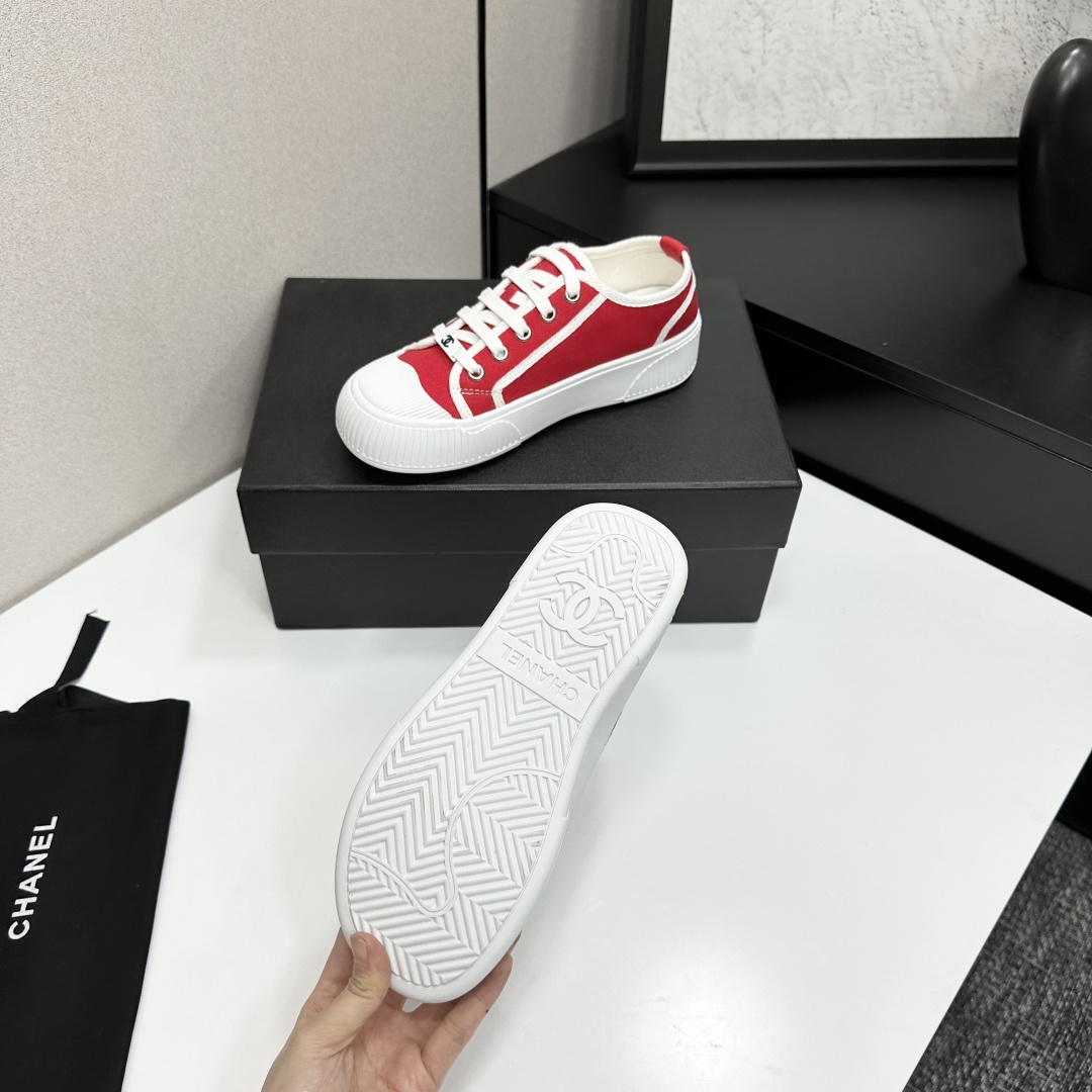 Pair of red canvas low-top sneakers with thick white platform soles and white laces - Hình 4
