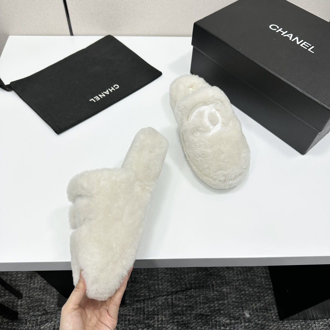 Pair of white fluffy faux fur slippers with designer logo embroidery on a black luxury display box - Hình 9