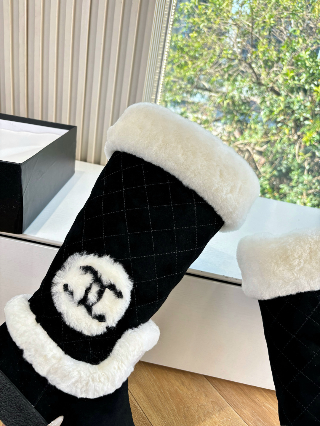 Black quilted mid-calf winter boots with white faux fur trim and a circular CC logo on the side. - Hình 8