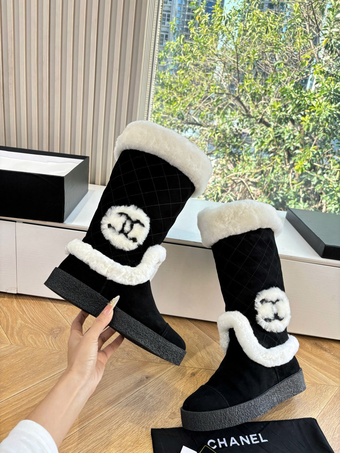 Black quilted mid-calf winter boots with white faux fur trim and a circular CC logo on the side. - Hình 7