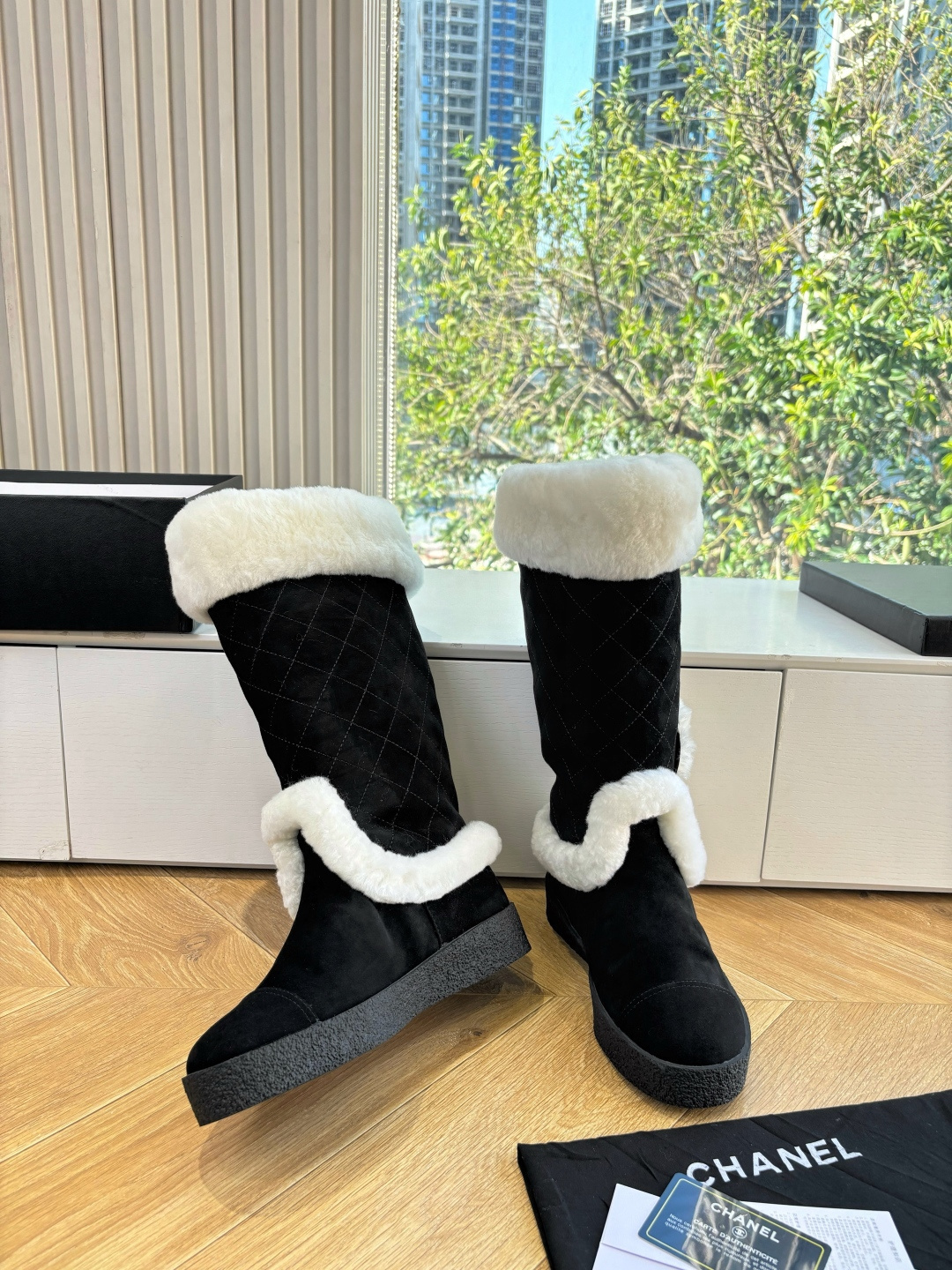 Black quilted mid-calf winter boots with white faux fur trim and a circular CC logo on the side. - Hình 6