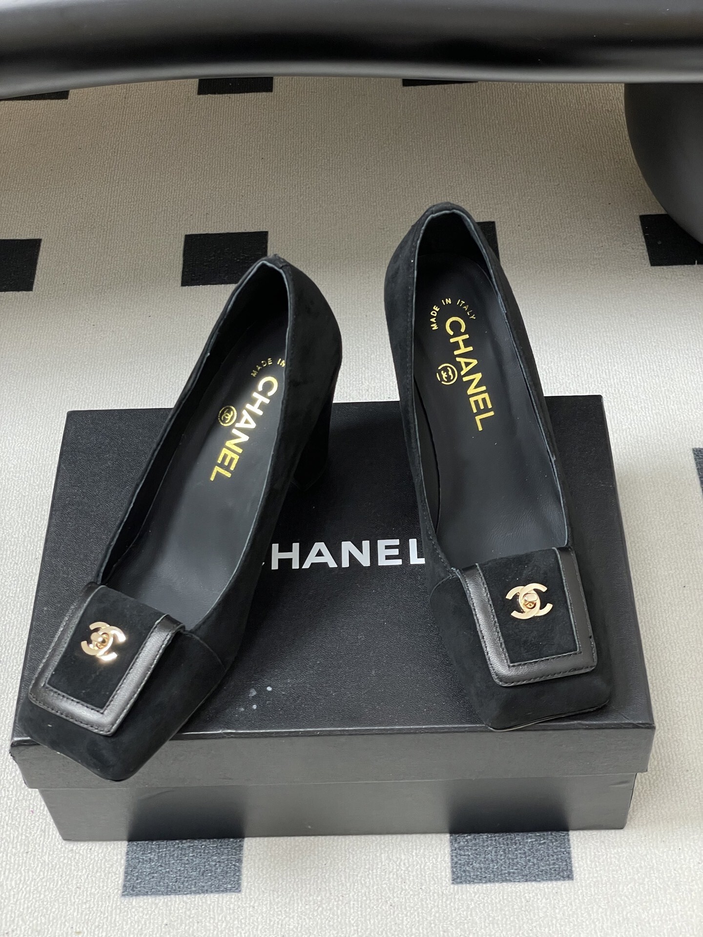 A pair of luxury Chanel black suede square-toe pumps featuring gold CC logo buckles and block heels. - Hình 5