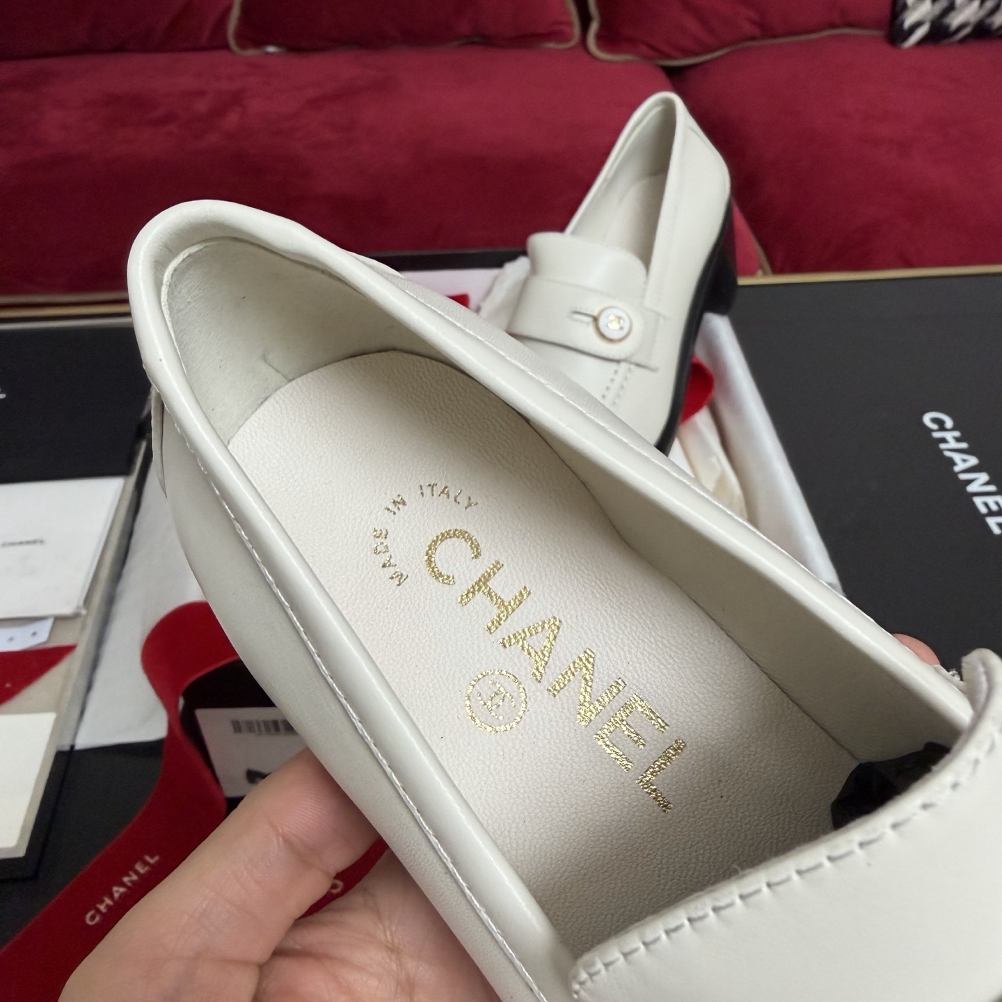 Pair of cream Chanel leather loafers with gold CC logo button and black block heel in original luxury packaging - Hình 7