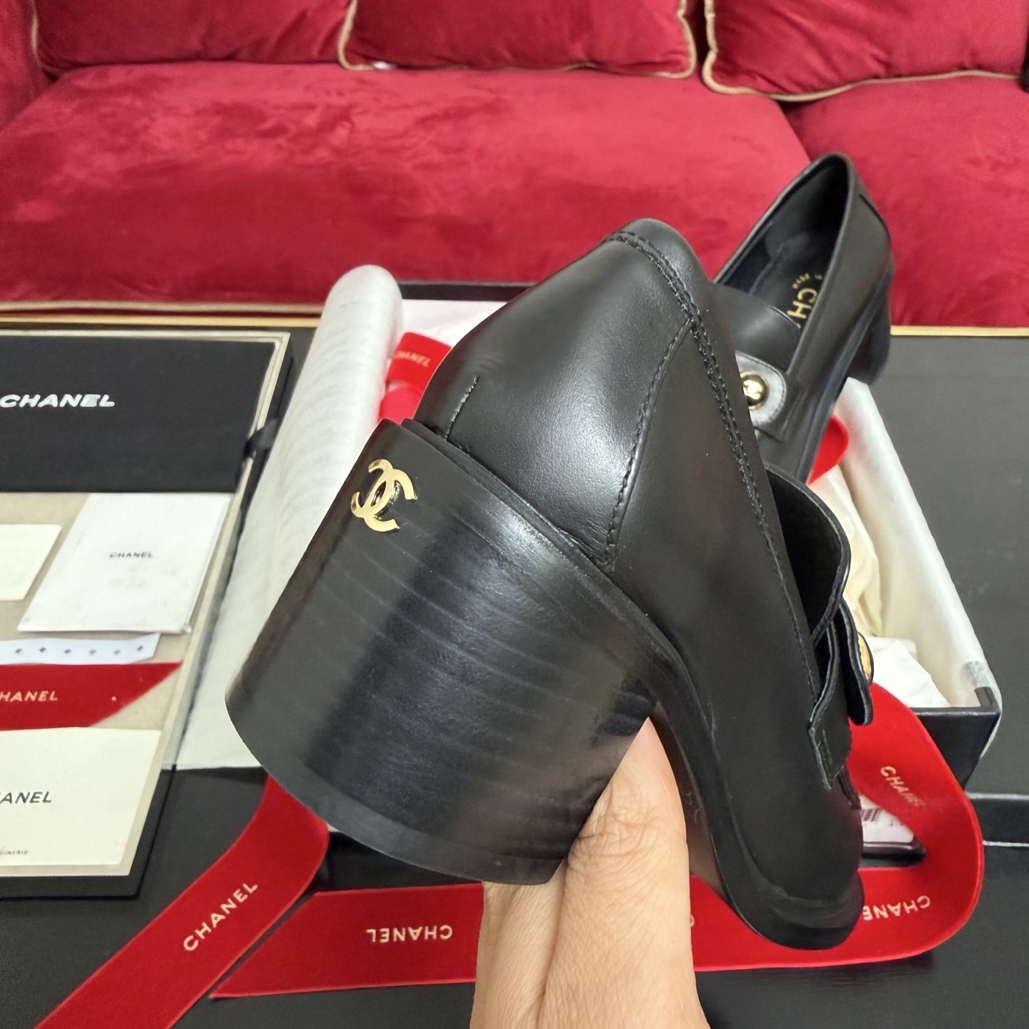 Authentic Chanel black leather loafers with block heels and gold CC logo buttons displayed in a box - Hình 8