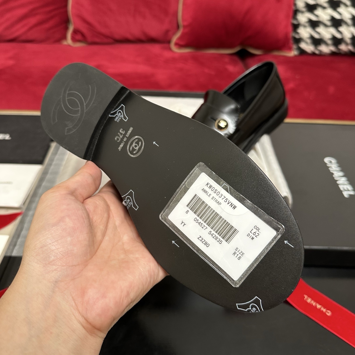 Pair of black Chanel leather loafers with gold CC buttons in original packaging with red ribbon - Hình 9