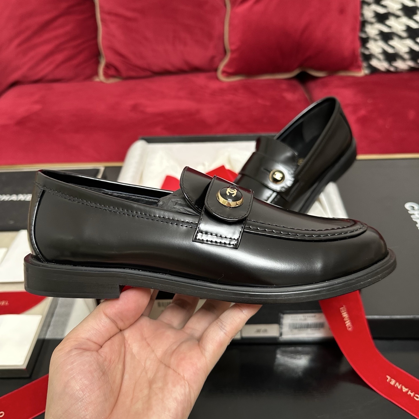 Pair of black Chanel leather loafers with gold CC buttons in original packaging with red ribbon - Hình 5
