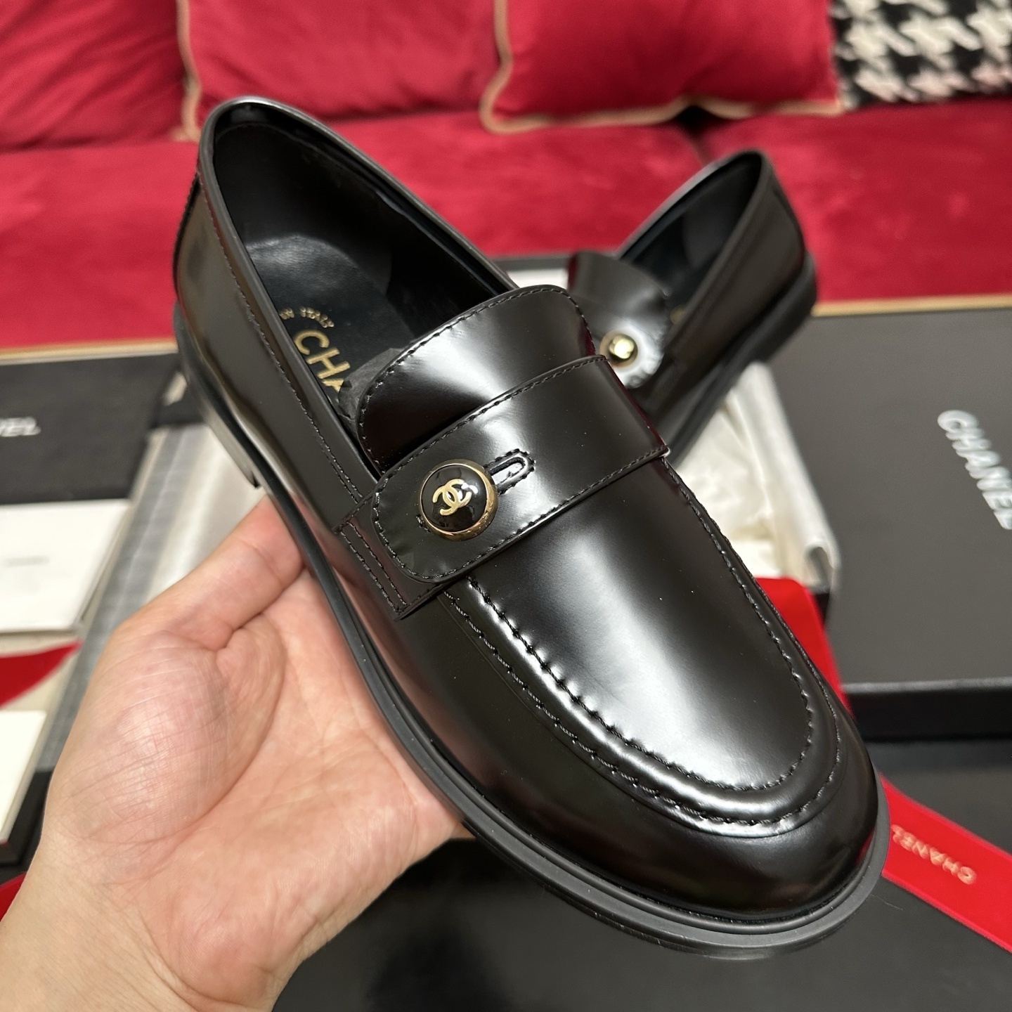 Pair of black Chanel leather loafers with gold CC buttons in original packaging with red ribbon - Hình 4