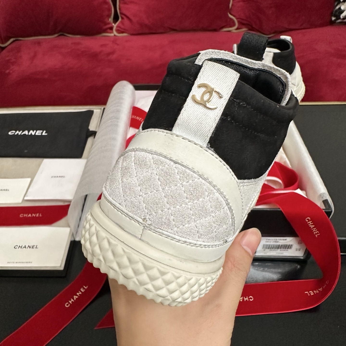 Pair of Chanel high-top sneakers in white and black suede with CC logo and original packaging. - Hình 8