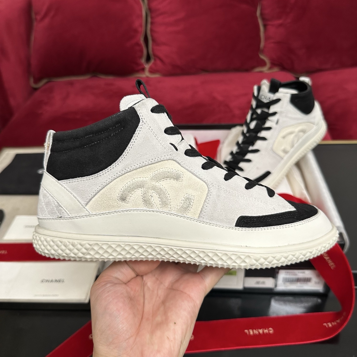 Pair of Chanel high-top sneakers in white and black suede with CC logo and original packaging. - Hình 5
