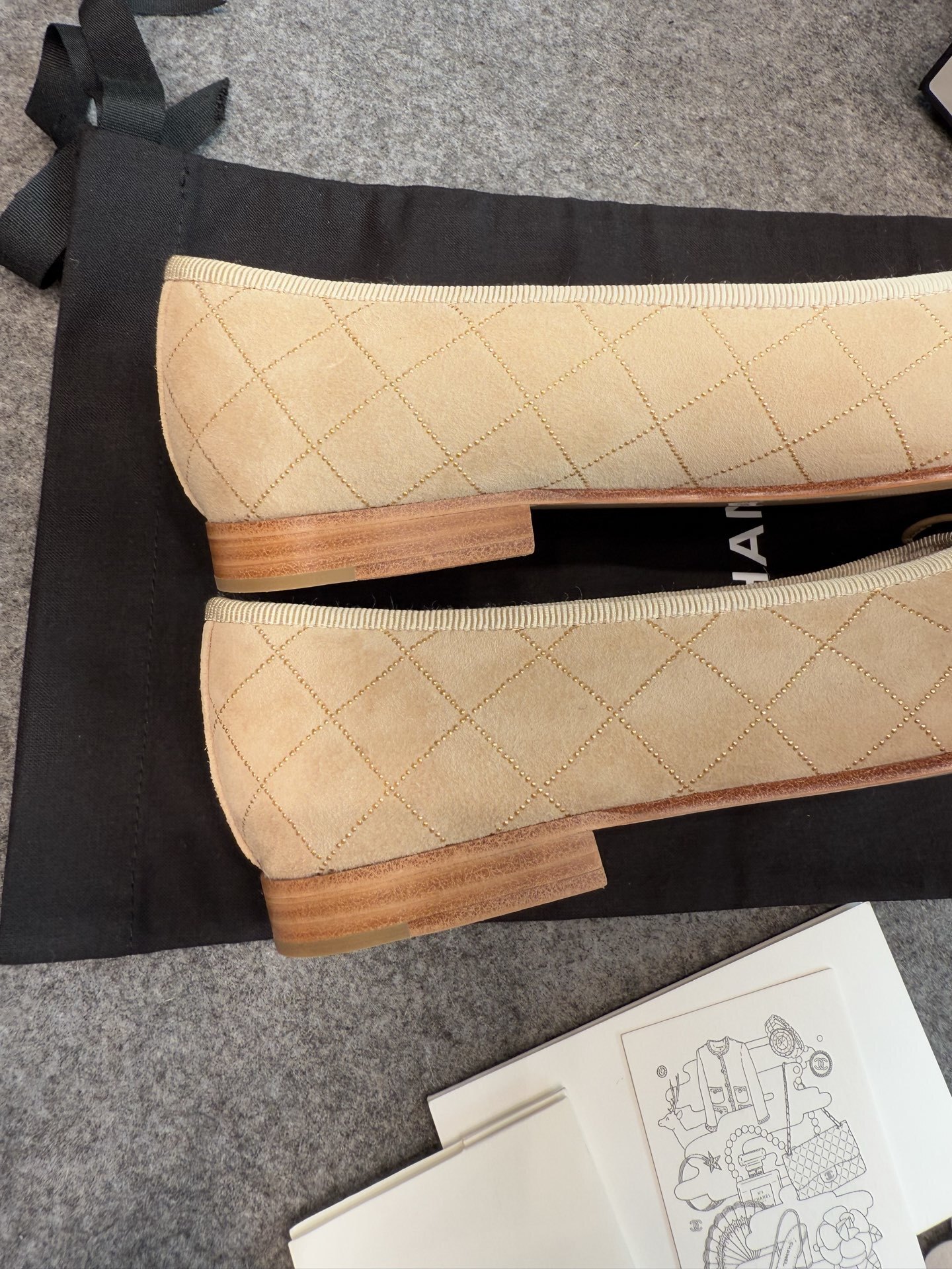 A pair of beige Chanel quilted lambskin ballerina flats with black cap toes and gold stud detailing. - Hình 8