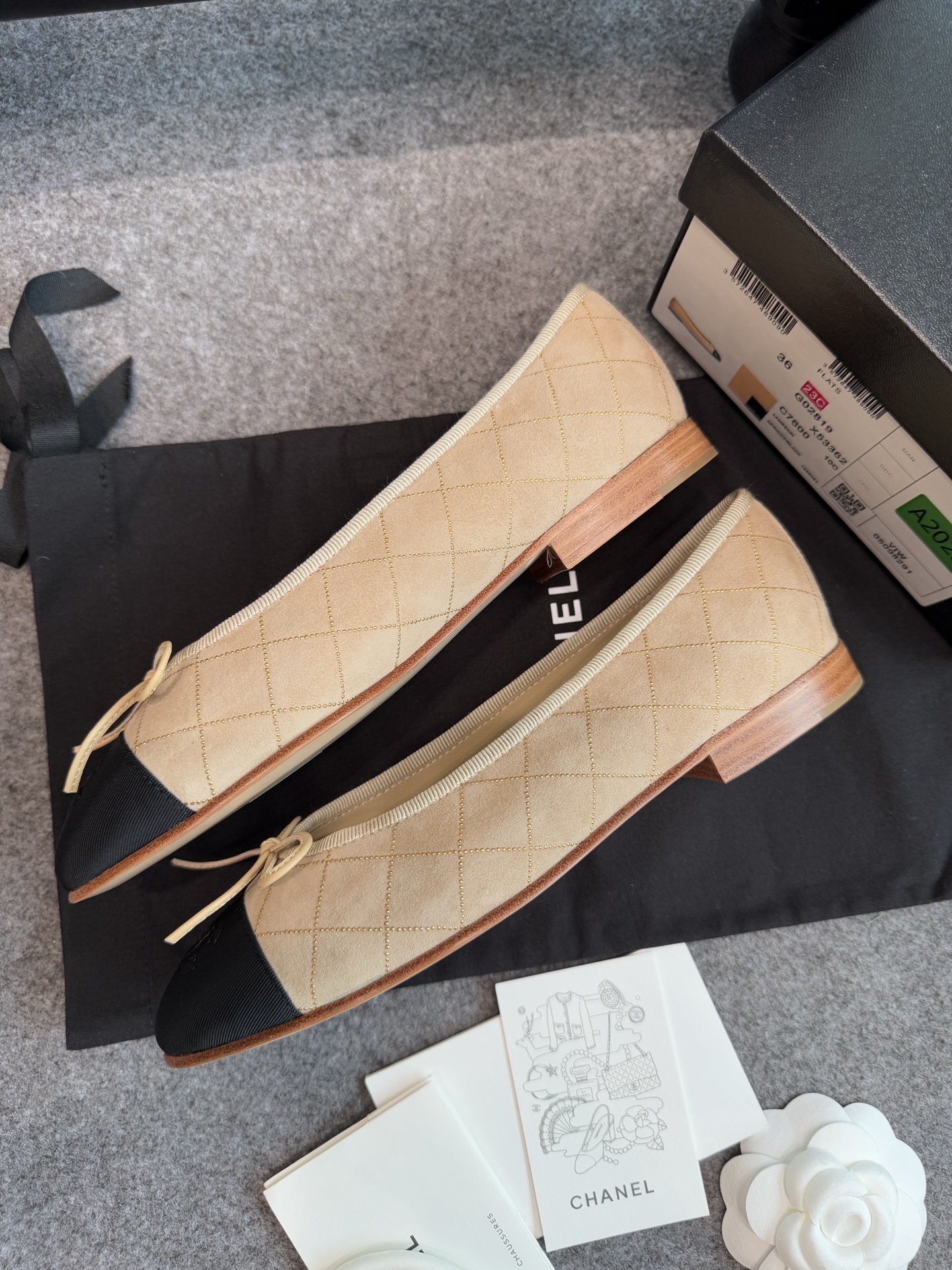 A pair of beige Chanel quilted lambskin ballerina flats with black cap toes and gold stud detailing. - Hình 6