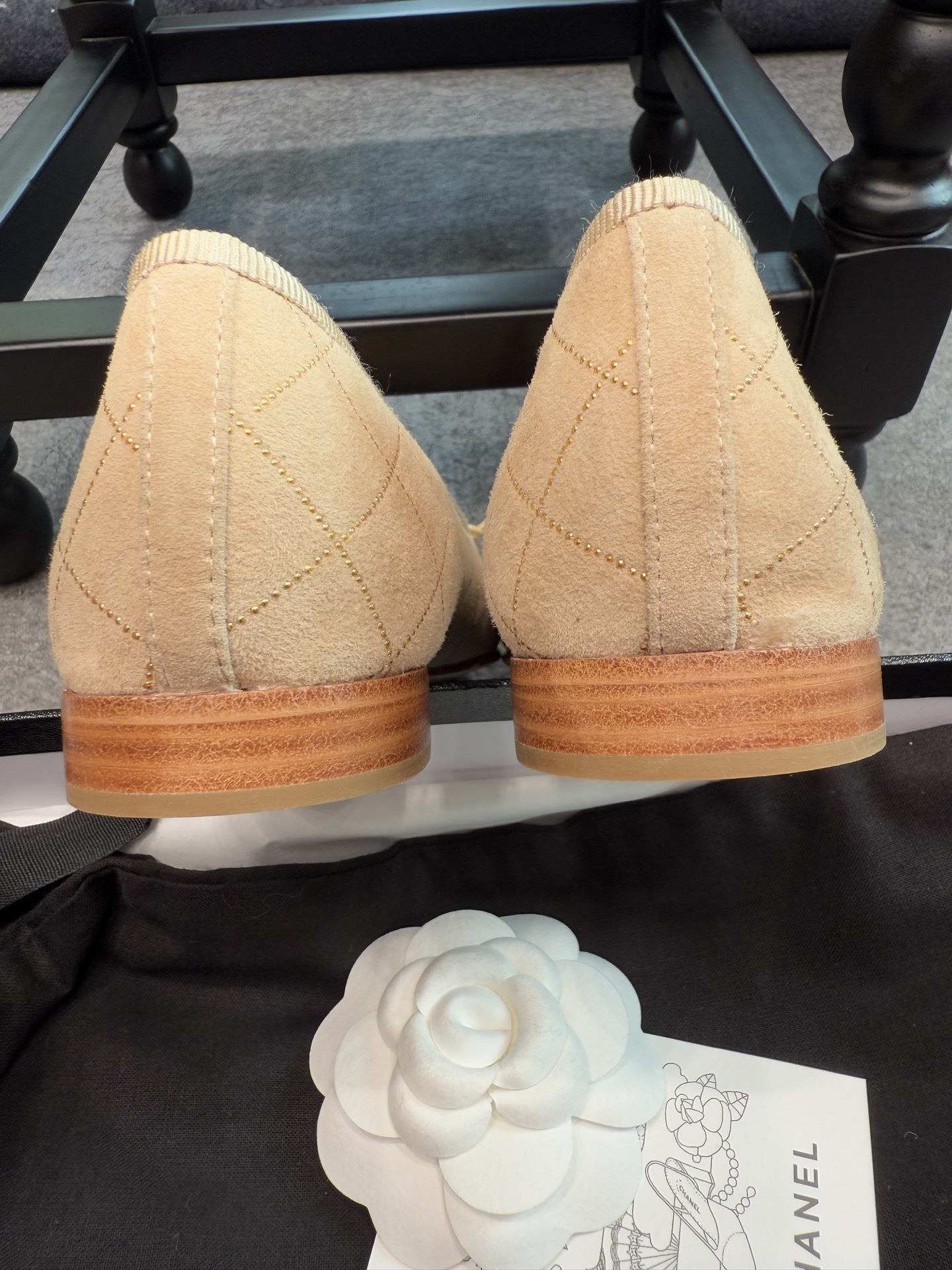 A pair of beige Chanel quilted lambskin ballerina flats with black cap toes and gold stud detailing. - Hình 3