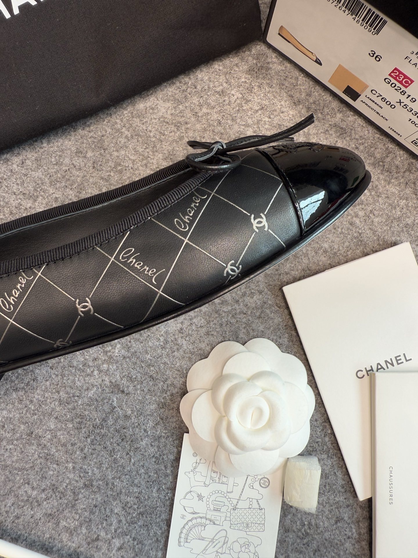 A pair of black Chanel quilted ballerina flats with patent leather toe caps and silver logo script detailing. - Hình 3