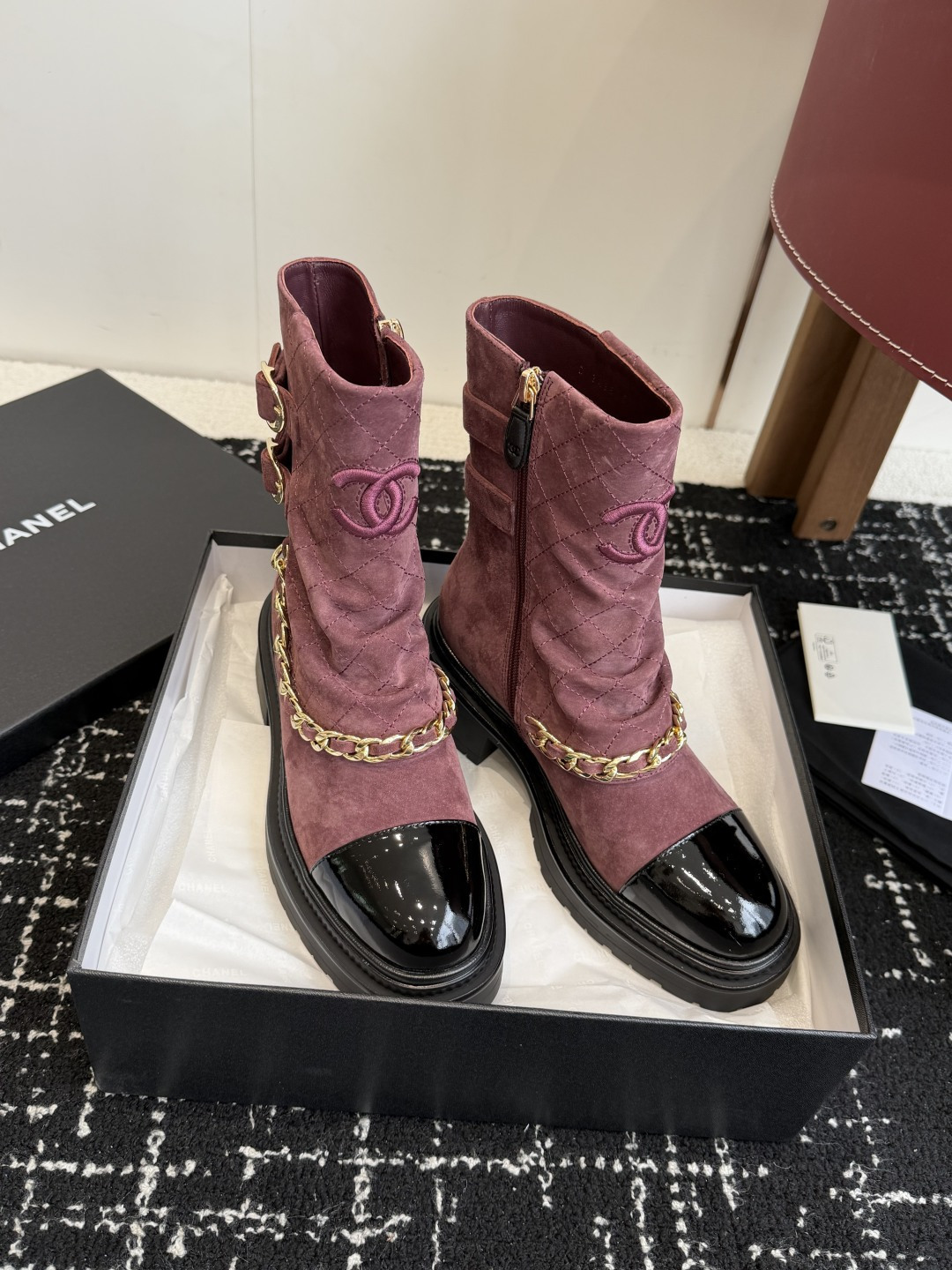 Luxury Chanel burgundy quilted suede ankle boots with black patent toe cap and decorative gold chain - Hình 3
