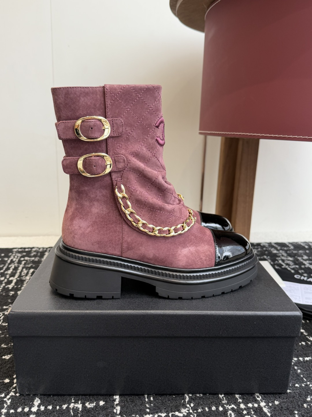 Luxury Chanel burgundy quilted suede ankle boots with black patent toe cap and decorative gold chain - Hình 2