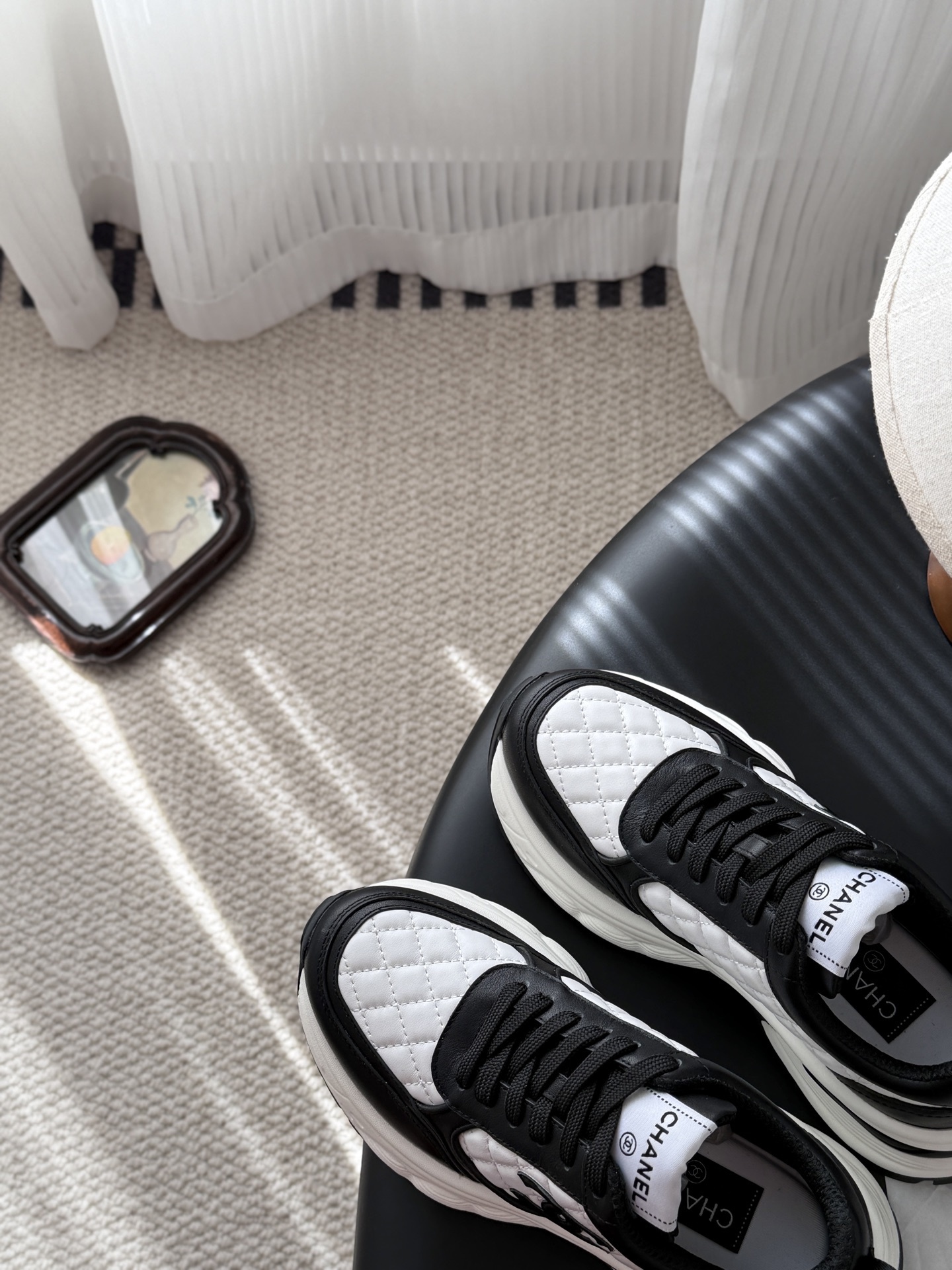 Pair of luxury Chanel women's sneakers in black and white quilted leather with chunky soles and CC logo. - Hình 7