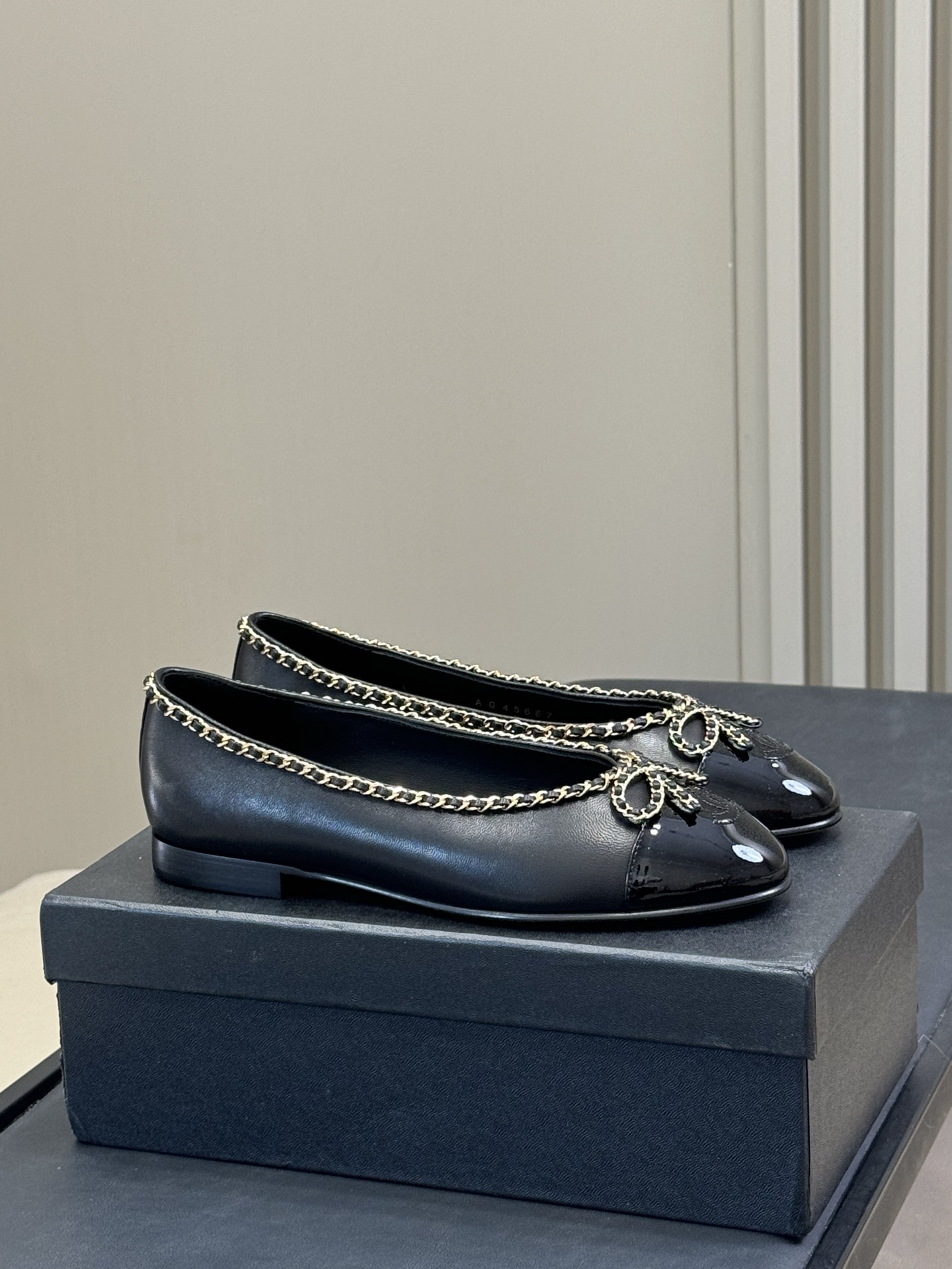 Chanel Black Leather Ballet Flats with Gold Chain Trim & Bow