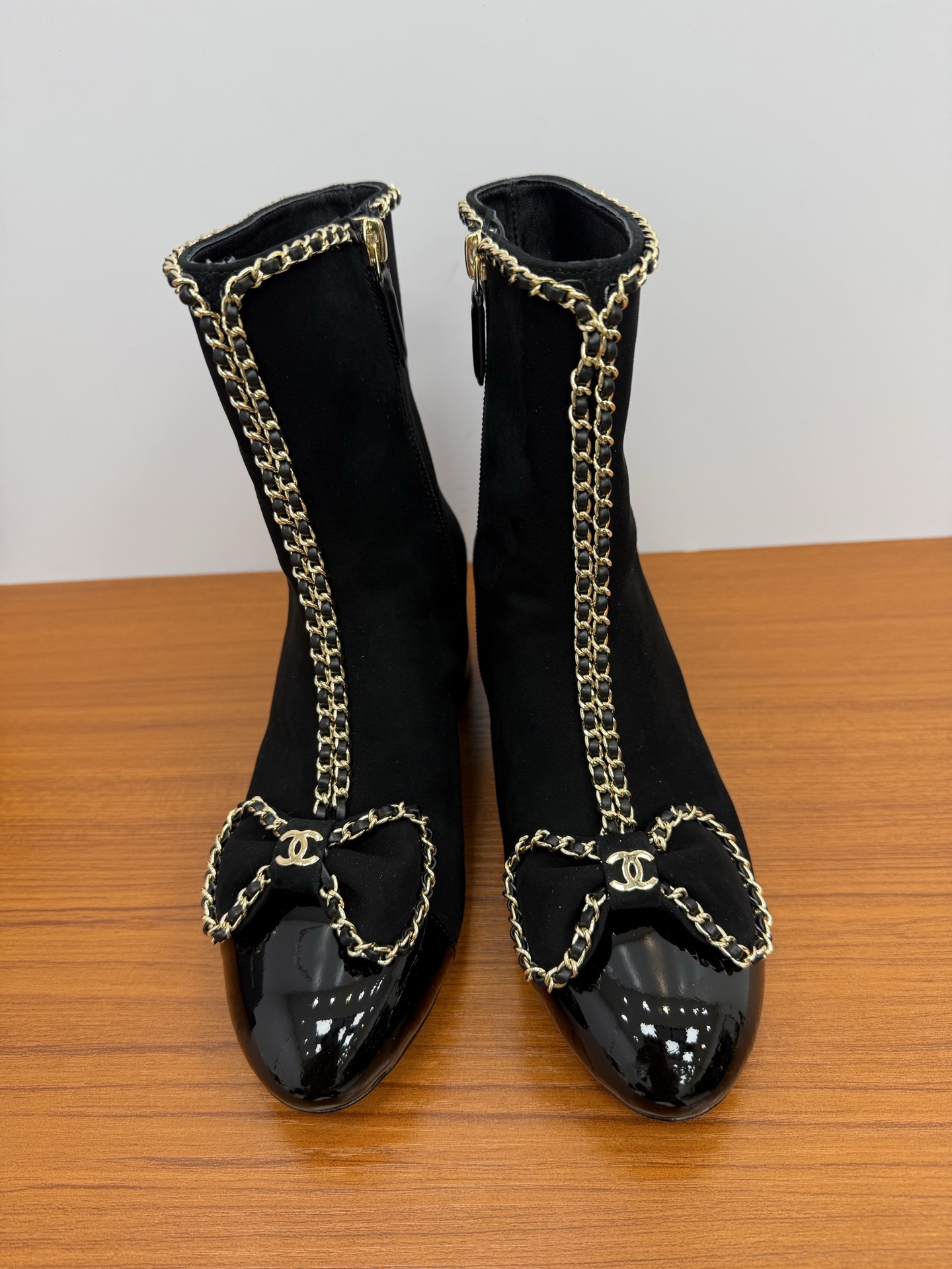 Luxury Chanel Suede Ankle Boots with Gold Chain & CC Logo Bow