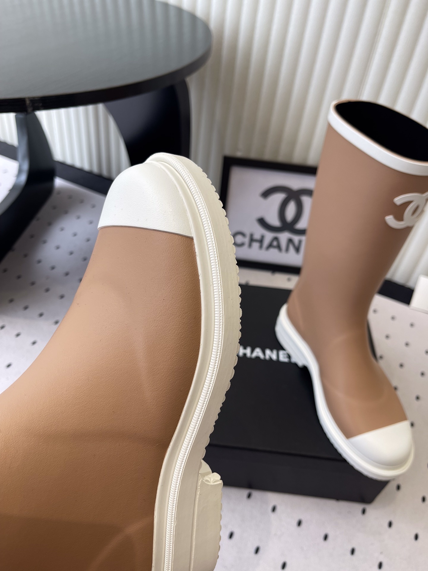 A pair of Chanel tall rain boots in beige and white featuring the CC logo on the front - Hình 6