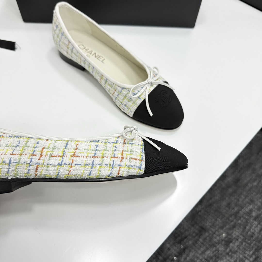 Chanel multi-color tweed ballerina flats with black toe caps and white bows displayed on a black box - Hình 10