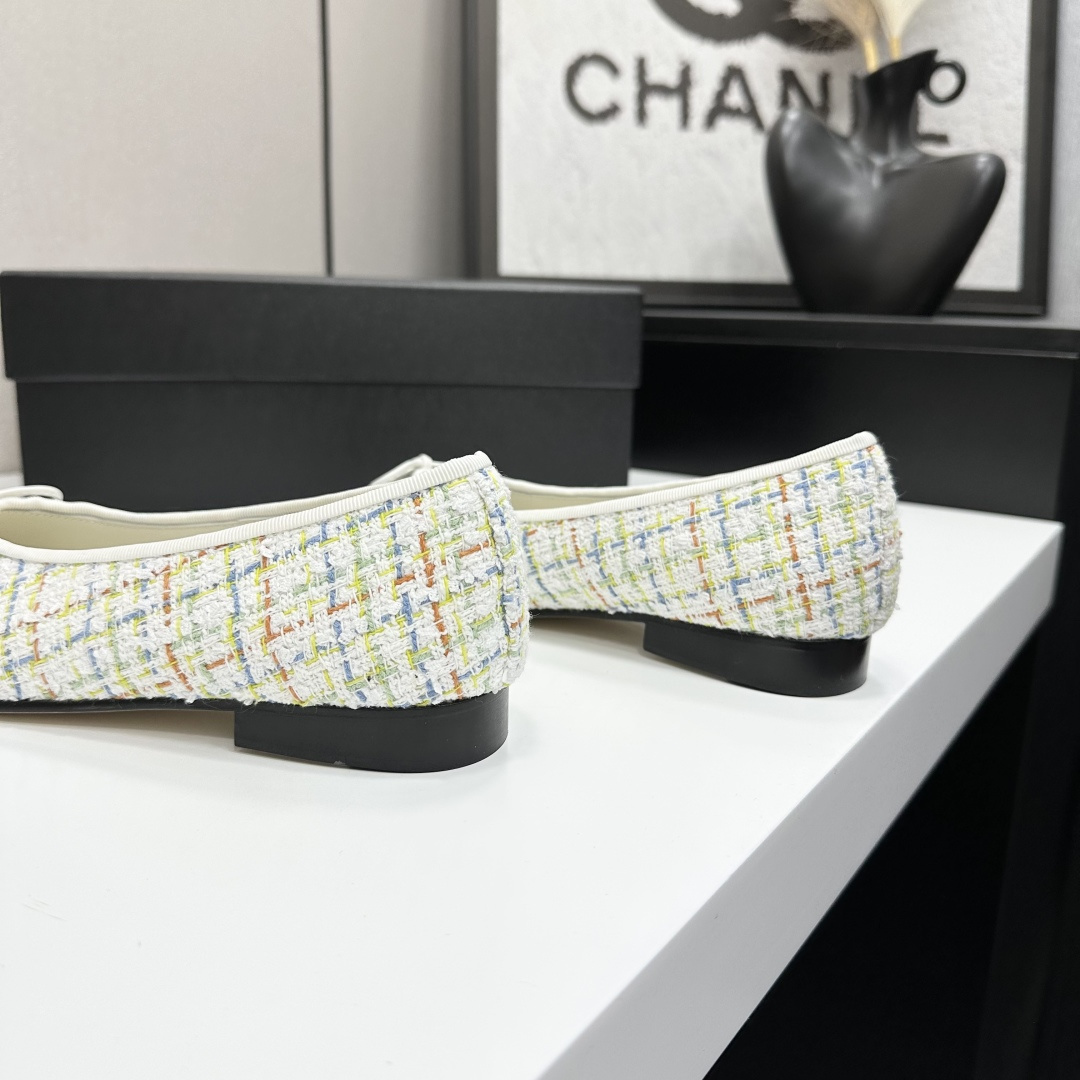 Chanel multi-color tweed ballerina flats with black toe caps and white bows displayed on a black box - Hình 8