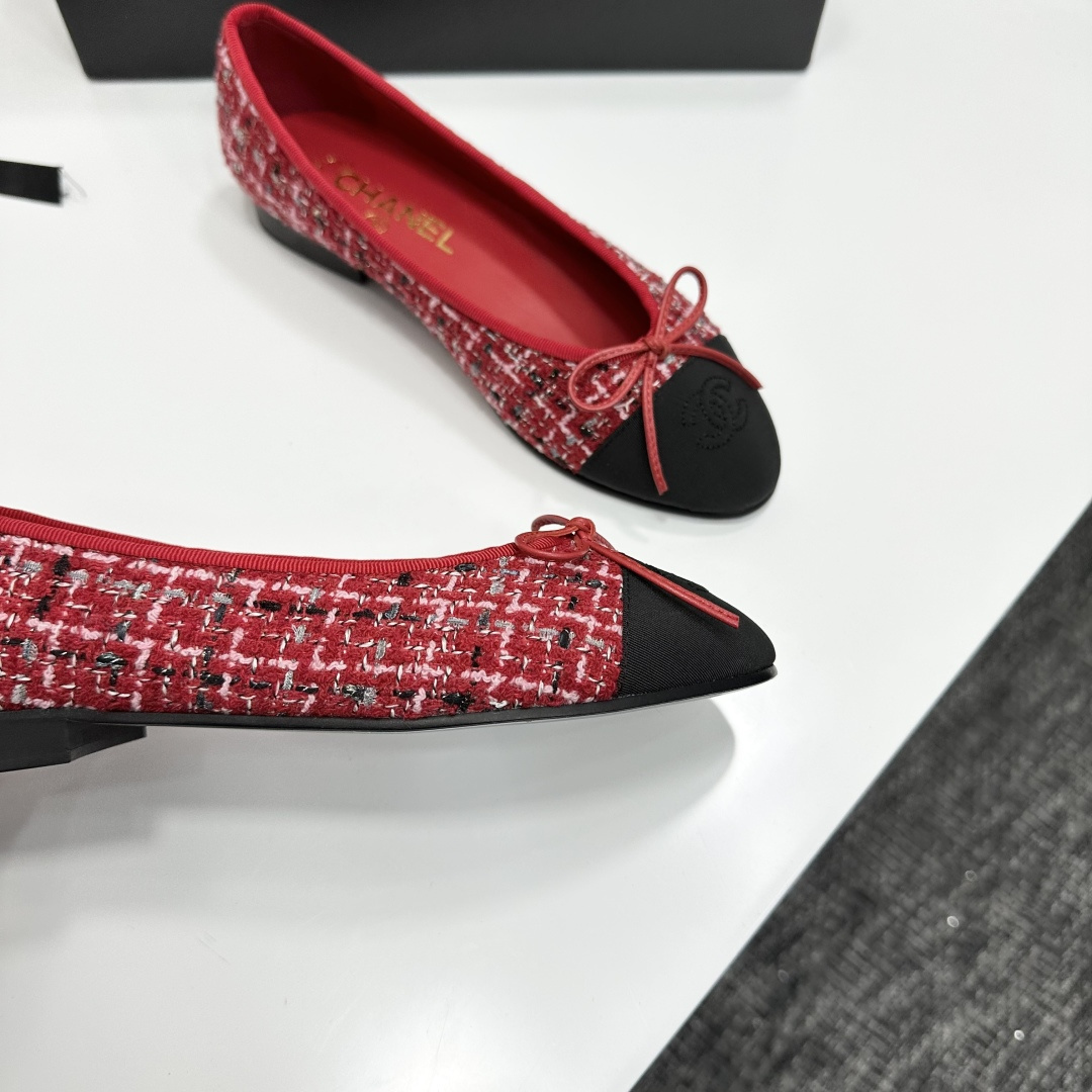 A pair of luxury Chanel ballet flats made of red tweed with black cap toes and CC logo on a black designer box - Hình 10