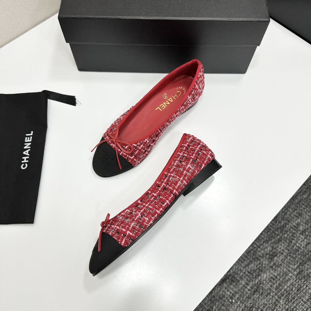 A pair of luxury Chanel ballet flats made of red tweed with black cap toes and CC logo on a black designer box - Hình 7