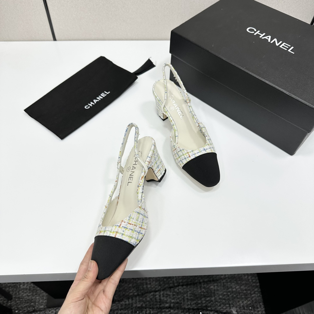 Pair of Chanel multi-color pastel tweed slingback pumps with black cap toe and block heel on a black box. - Hình 2