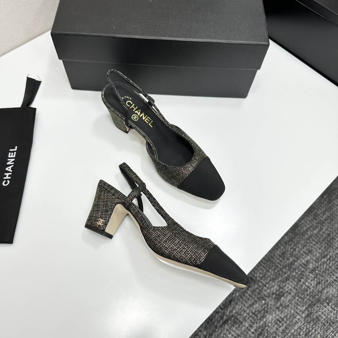 A pair of Chanel gold and black metallic tweed slingback pumps with black cap toes resting on a black designer box. - Hình 9
