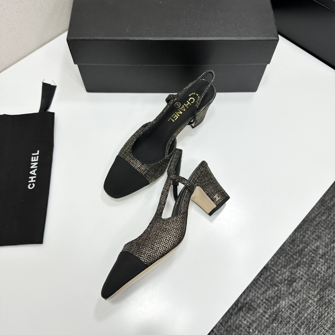 A pair of Chanel gold and black metallic tweed slingback pumps with black cap toes resting on a black designer box. - Hình 6