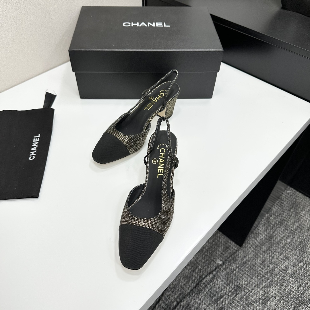 A pair of Chanel gold and black metallic tweed slingback pumps with black cap toes resting on a black designer box. - Hình 5