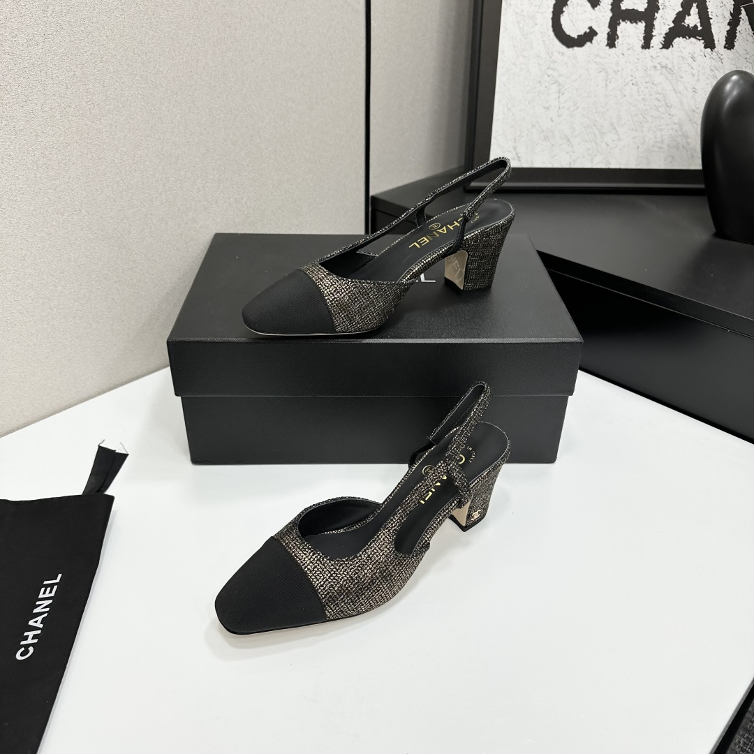 A pair of Chanel gold and black metallic tweed slingback pumps with black cap toes resting on a black designer box. - Hình 2