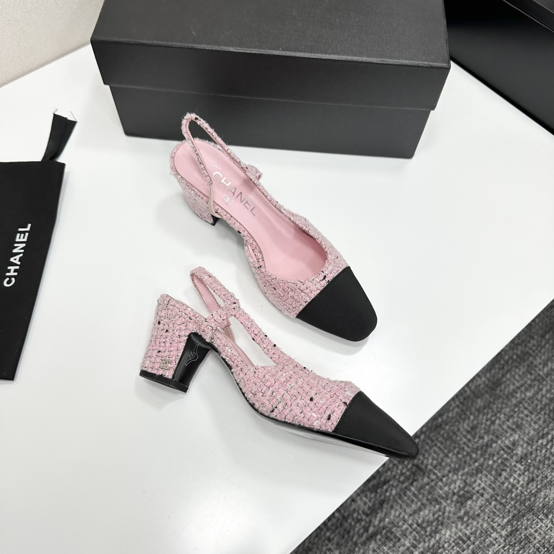 A pair of luxury Chanel pink tweed slingback pumps with a black toe cap and block heel displayed on a black designer box. - Hình 10