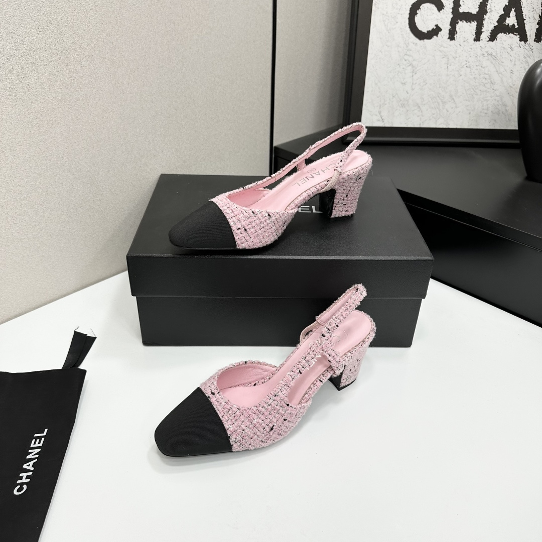 A pair of luxury Chanel pink tweed slingback pumps with a black toe cap and block heel displayed on a black designer box. - Hình 3