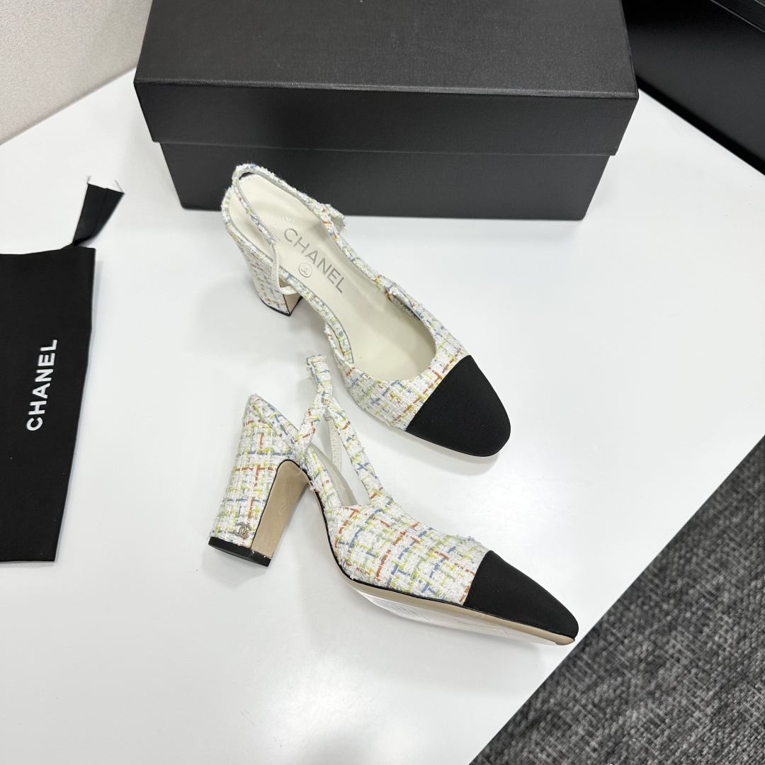 Pair of Chanel multi-color tweed slingback pumps with black cap toe and block heel displayed on a black box. - Hình 8
