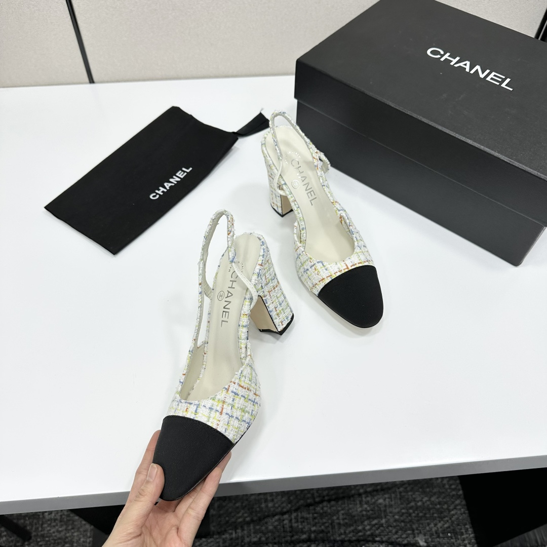 Pair of Chanel multi-color tweed slingback pumps with black cap toe and block heel displayed on a black box. - Hình 7