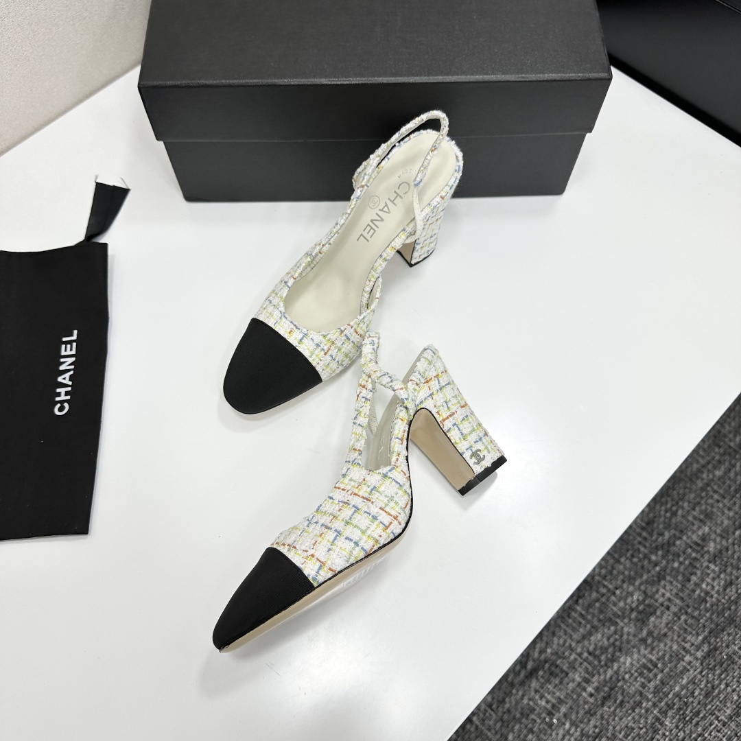 Pair of Chanel multi-color tweed slingback pumps with black cap toe and block heel displayed on a black box. - Hình 5