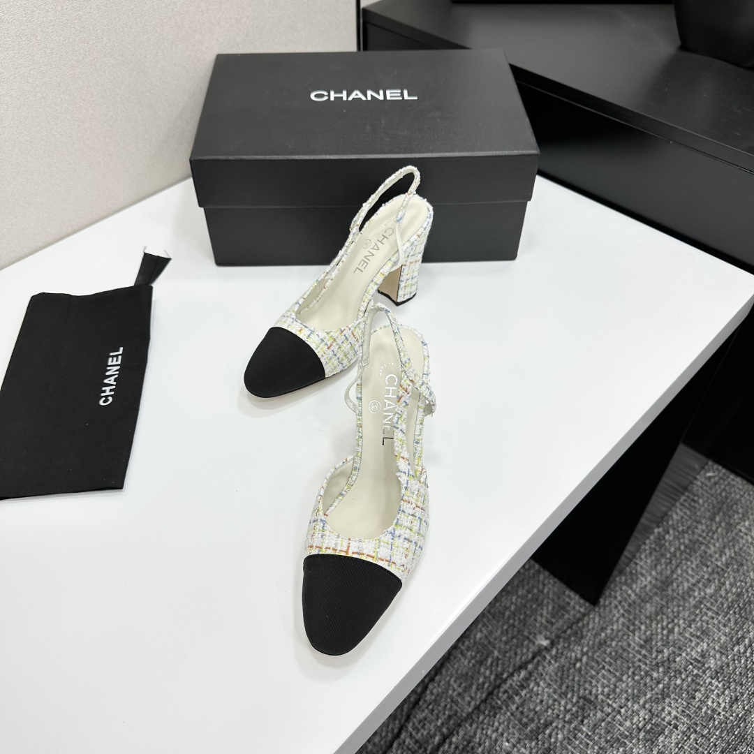 Pair of Chanel multi-color tweed slingback pumps with black cap toe and block heel displayed on a black box. - Hình 4