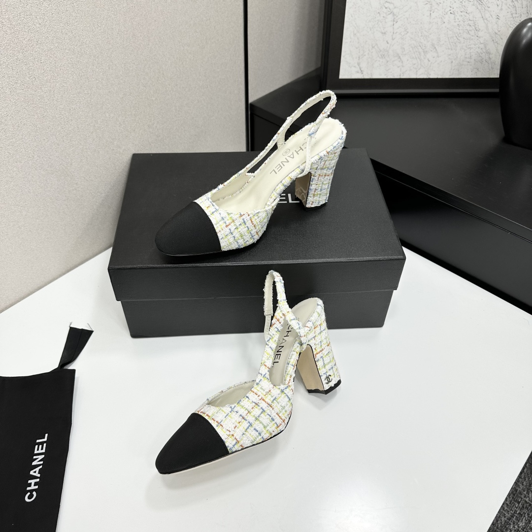 Pair of Chanel multi-color tweed slingback pumps with black cap toe and block heel displayed on a black box. - Hình 3
