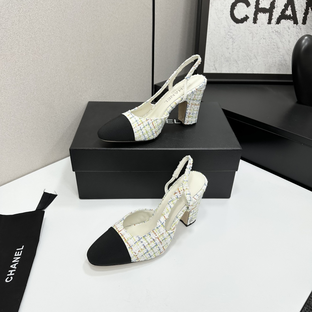 Pair of Chanel multi-color tweed slingback pumps with black cap toe and block heel displayed on a black box. - Hình 2